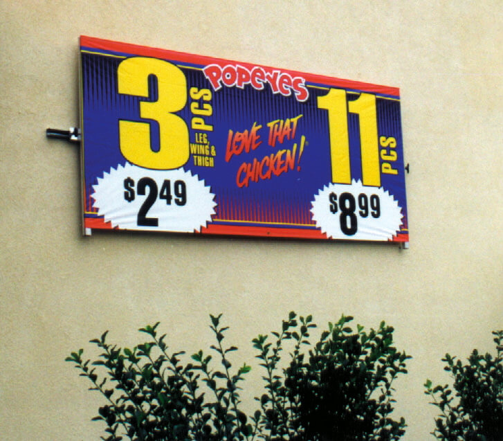 Wall mounted banner frames and signboards displaying deals