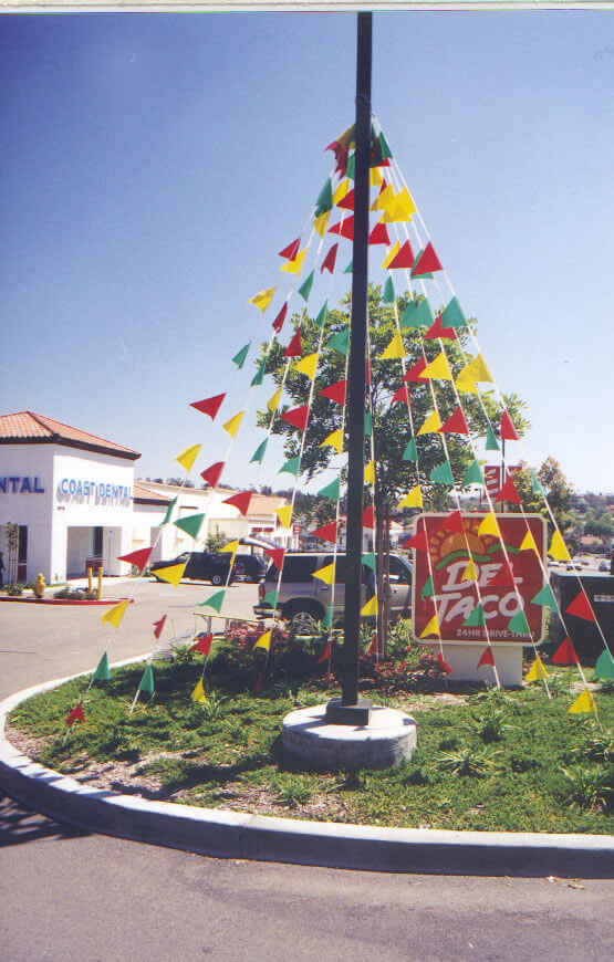 Blade flags outdoor displays in front of Del Taco