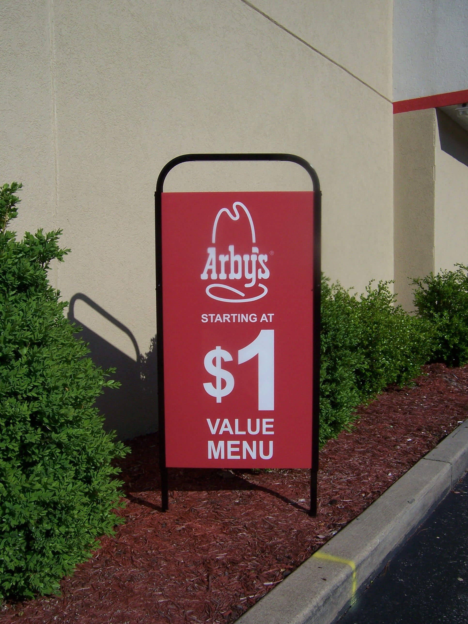 Exterior merchandising with drive thru displays at Arbys