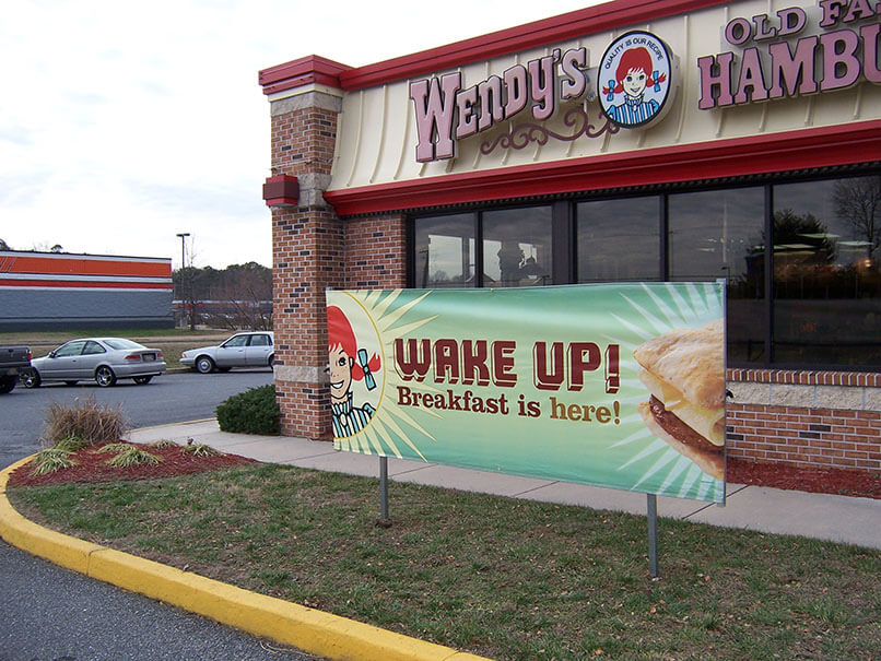 Lawn diplays in front of store advertising breakfast from Voxpop Marketing Systems